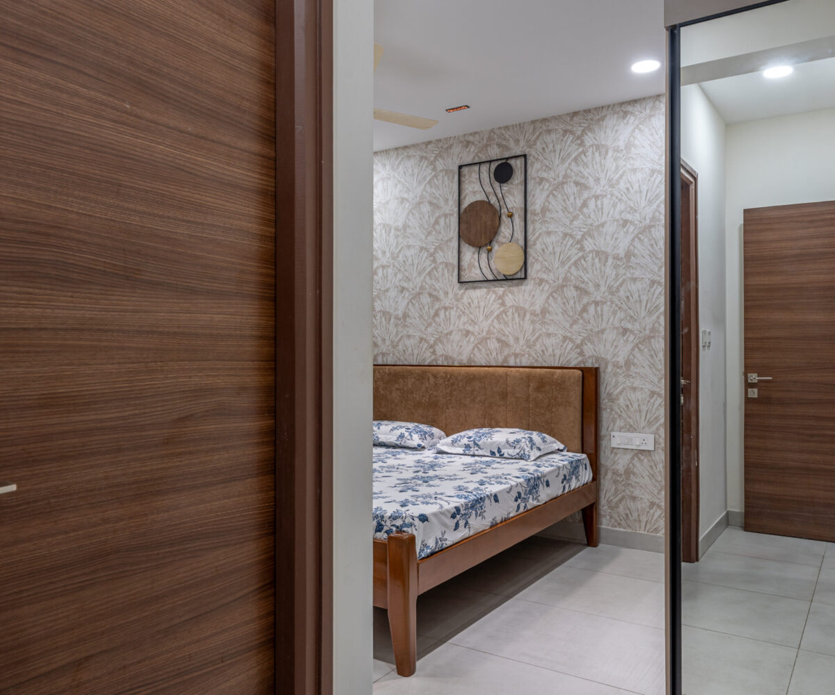 Modern bedroom design with deep maroon false ceiling and mood lighting