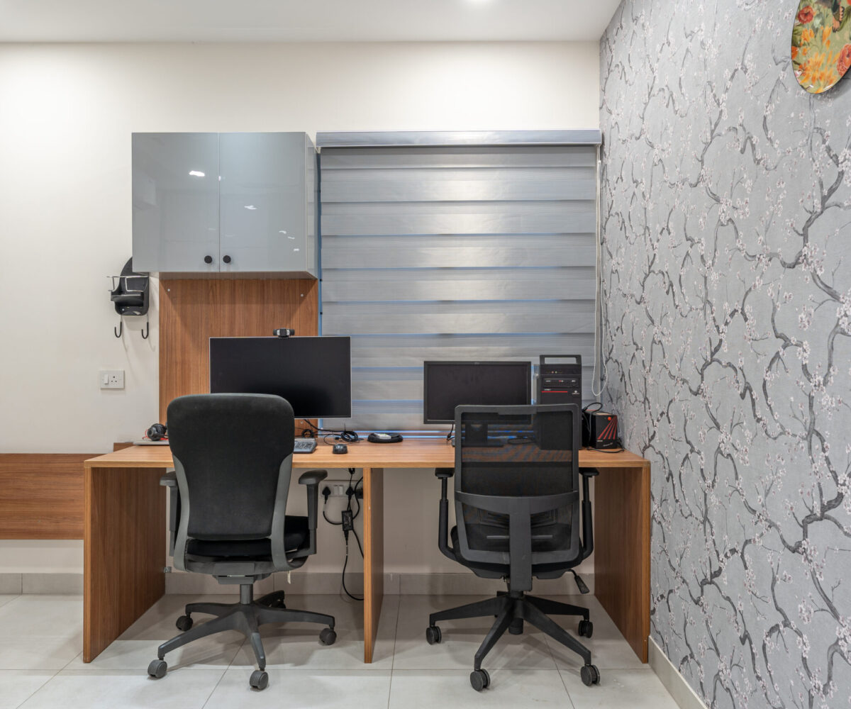 Minimalist bedroom featuring study unit with shelves and ergonomic working area